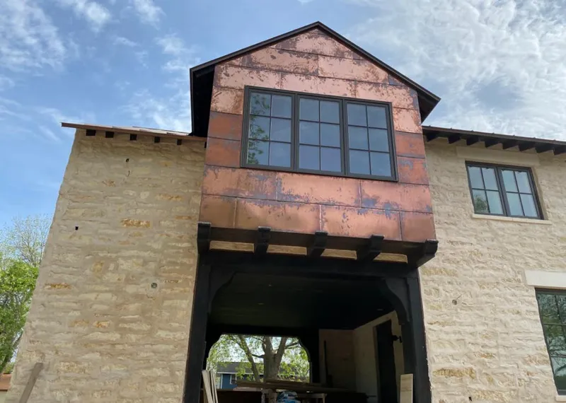 Copper metal panel facade on a stone building for Metal Roof Coating in Laguna Beach