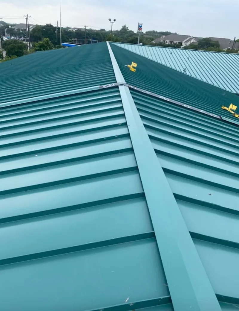 Green commercial metal roof ridge and valley for Metal Roof Repair in Laguna Beach